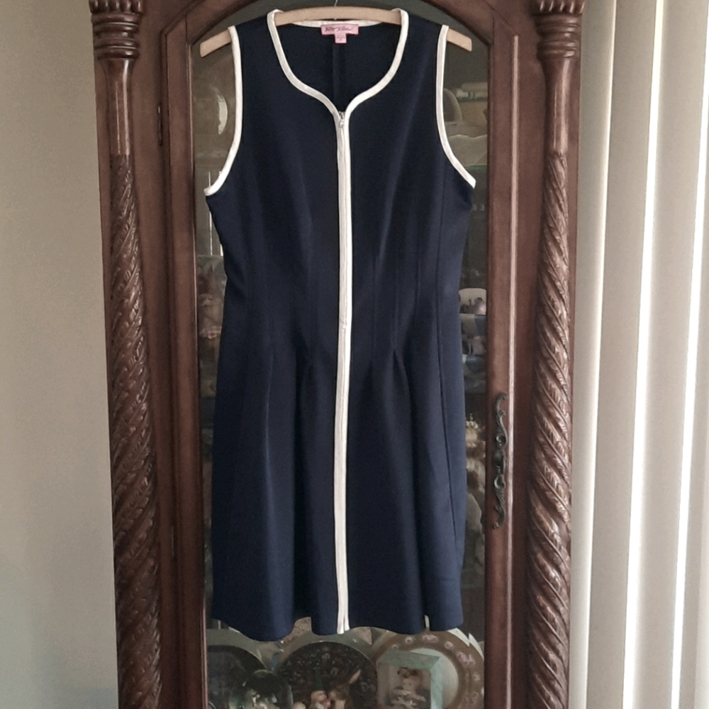 Navy blue dress with white piping.